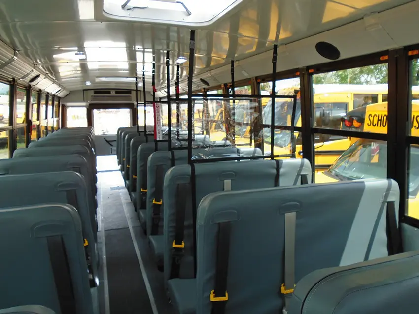 Multiple Soft Shield panels installed throughout a school bus passenger area